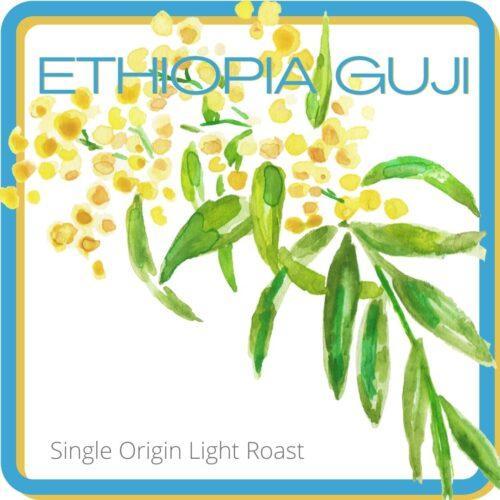 Ethiopia Guji square with an acacia flower cutting through. At the bottom says Single Origin Light Roast